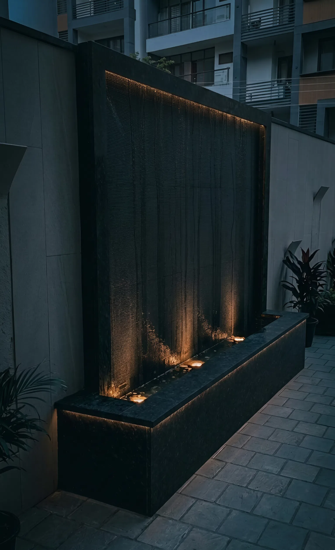 Outdoor curtain waterfall at night — Chattarpur Farms, Delhi